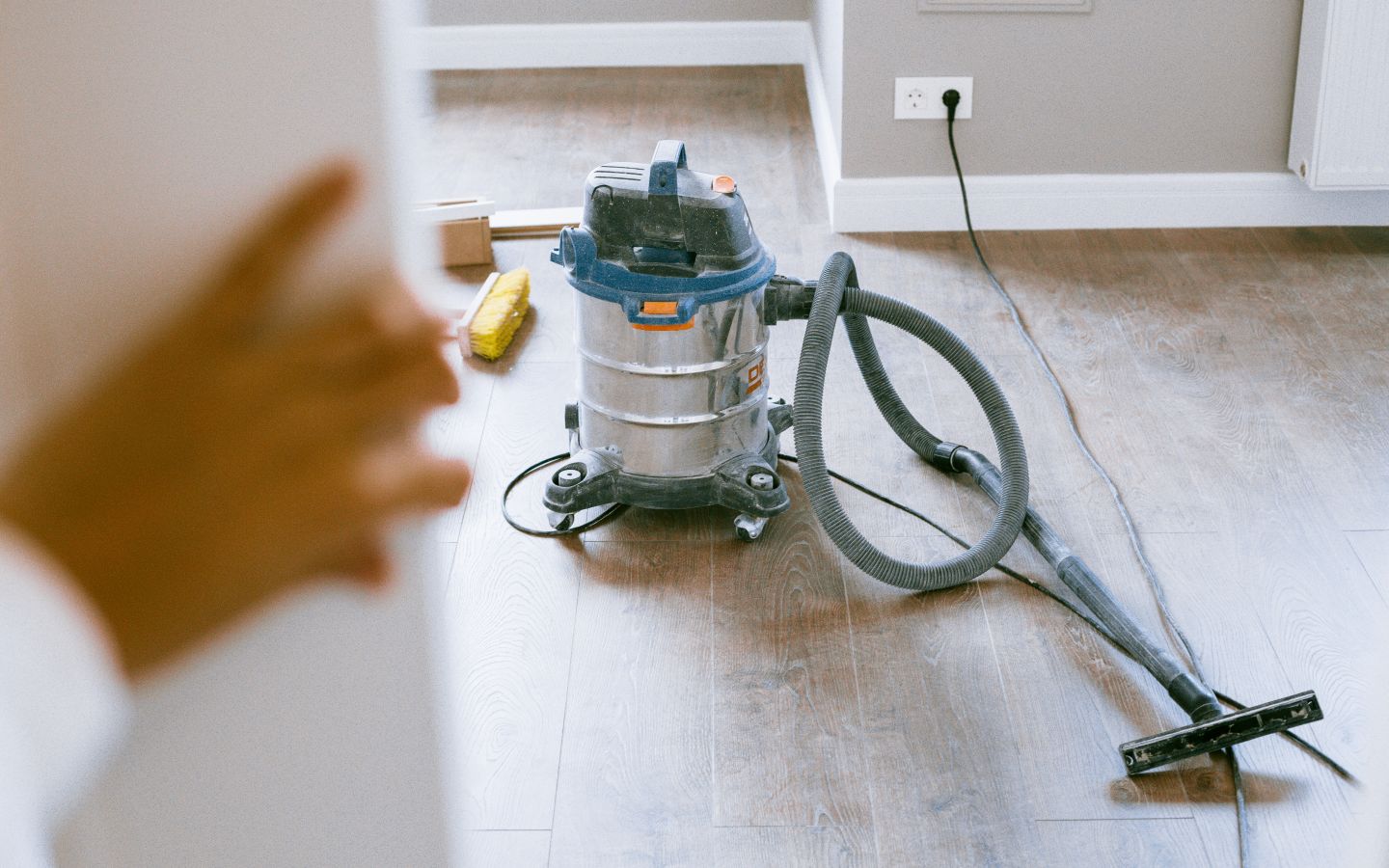 Professional dust-extraction equipment cleaning a newly renovated interior