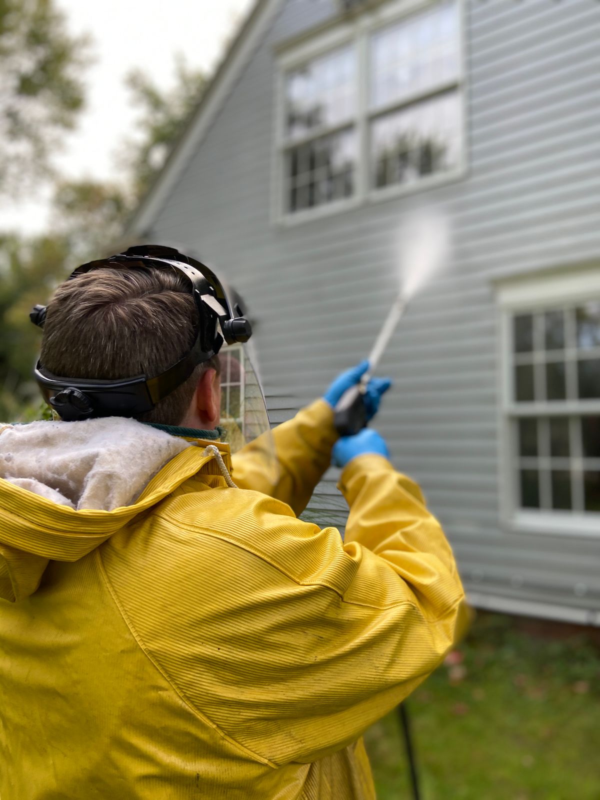 Residential driveway being pressure washed